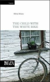 The child with the white bike