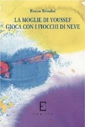 La moglie di Youssef gioca con i fiocchi di neve